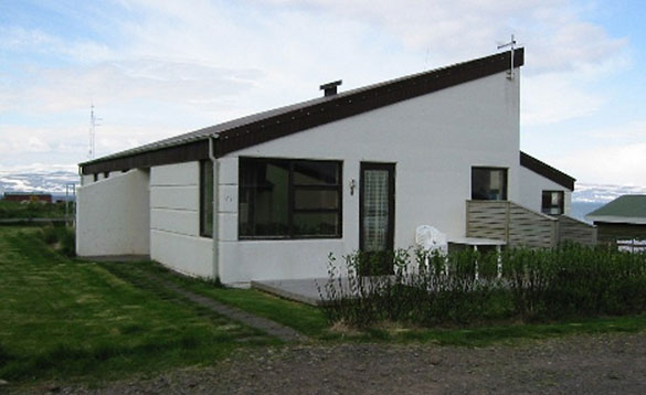 Single storey white building with sloping roof in Iceland/