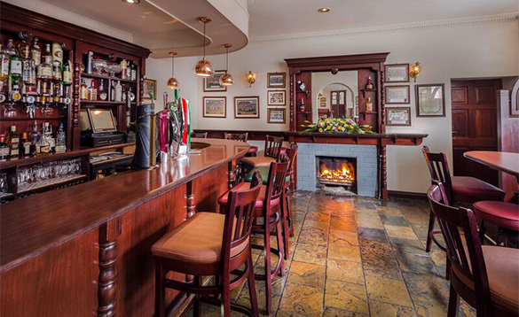 Open fire burning in the fireplace in the bar at the Breffni Arms, Arva/