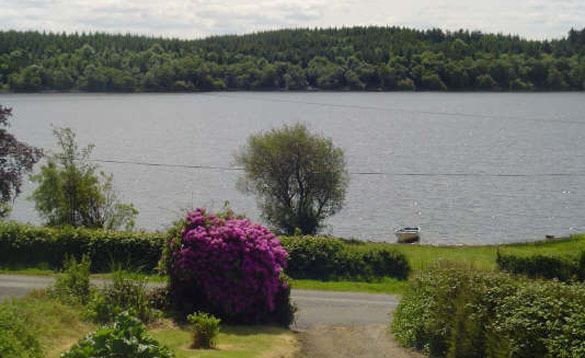 View across a driveway over a lake in Ireland/