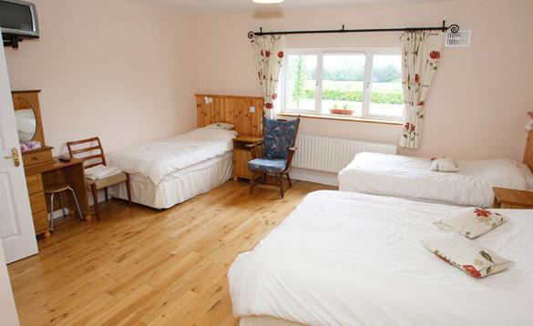 Bedroom with a double and two single beds/