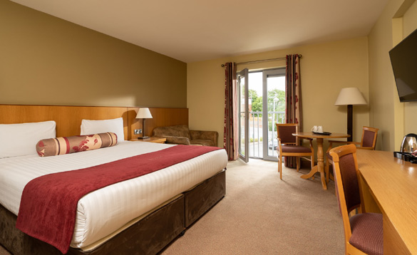 Hotel room with a double bed and seating area/