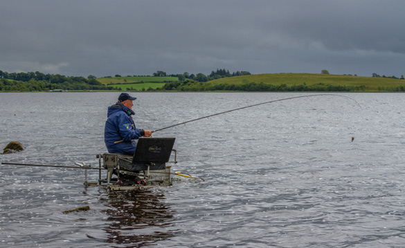 Angler fishing on a lake in Ireland/