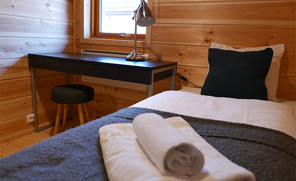 Bedroom in a cabin at Mikkelvik Brygge/