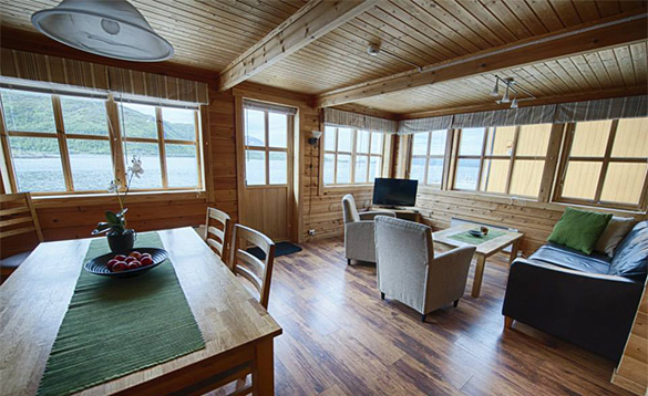 Living/dining room at Lauklines fishing centre with views across the fjord/
