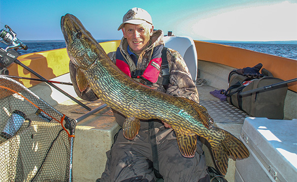 Angler with a pike caught in Sweden/