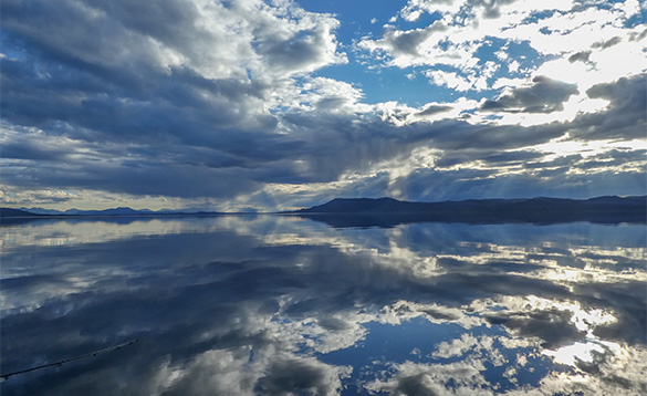 Clouds reflected in the calm waters in the Yukon/