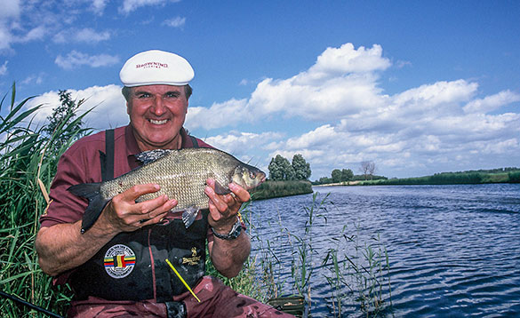 angler with small bream in Holland/