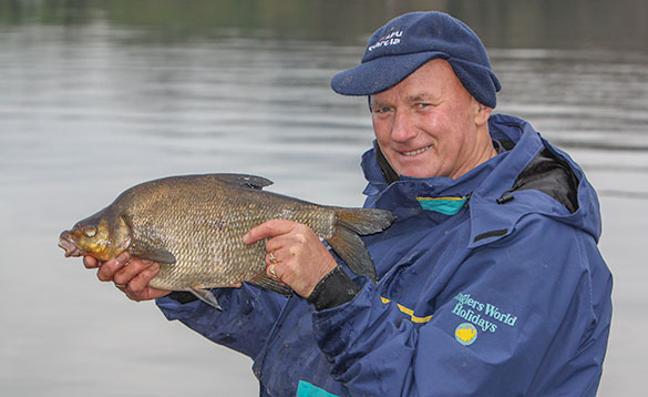 Angler holding a bream caught in Co Cavan in Autumn/