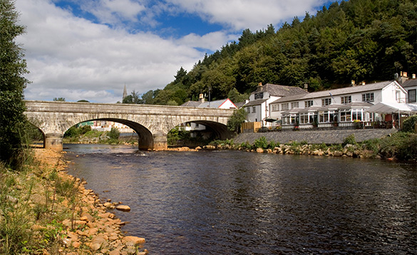 River flowing under a stone bridge/