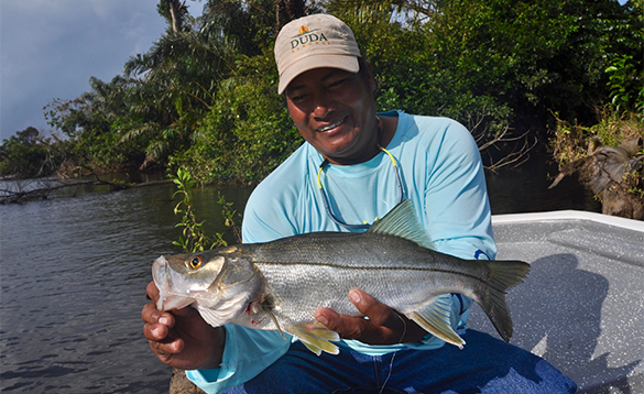 Angler on a boat with a snook in Nicaragua/