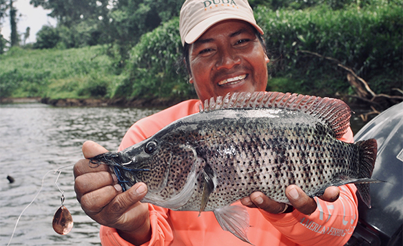 Angler holding a bass fish in Nicaragua/