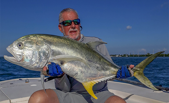 Angler holding a Jack Crevalle fish caught in Florida/