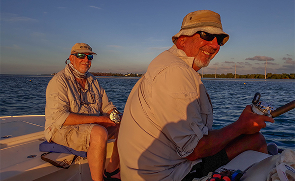 Two anglers fishing from a boat in Florida/