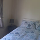 Double bed with striped zigzag bedding
