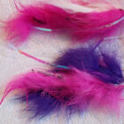 Close up of pink and purple fly fishing flies