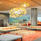 Hotel lobby with white seating and large round light shades