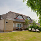 Semi detached dorma brick built chalets with thatched roof