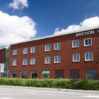 Three storey brick built hotel beside road in Holland