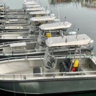 Row of Arvor boats moored against a jetty