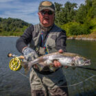 Angler holding a pink salmon caught in Alaska