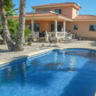 Holiday villa with swimming pool and palm trees
