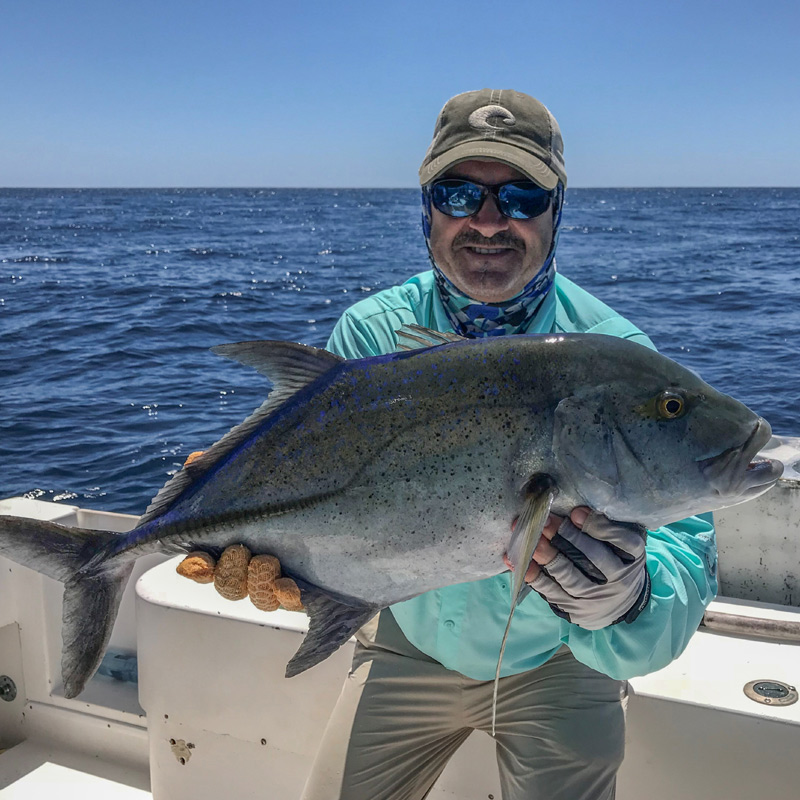 Angler holding a Jack Crevalle fish