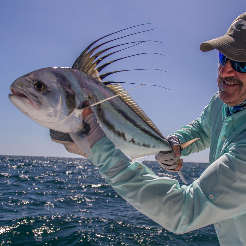 Angler holding a roosterfish