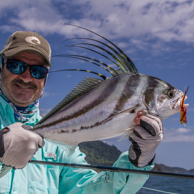 Angler holding a roosterfish