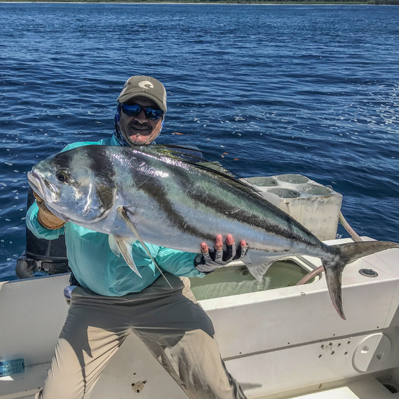 Angler holding a roosterfish