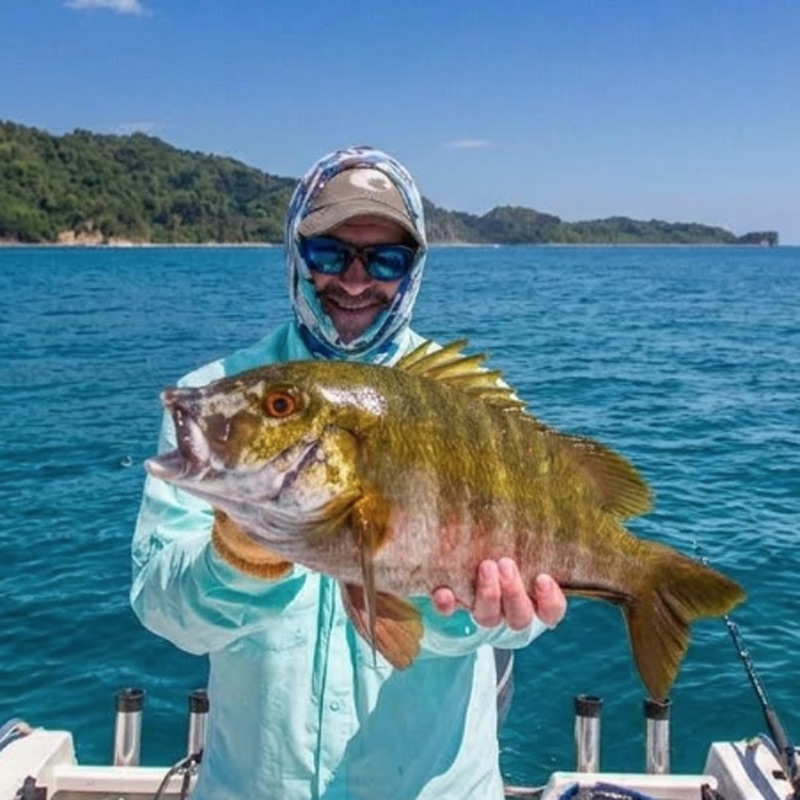 Angler holding a snapper fish