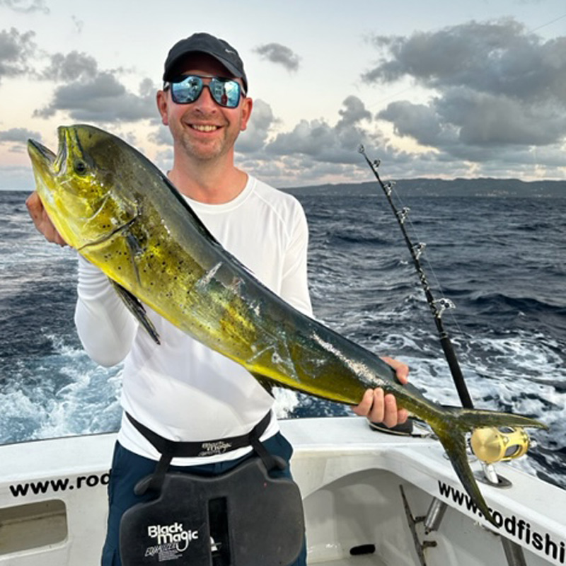 Angler holding a mahi mahi fish