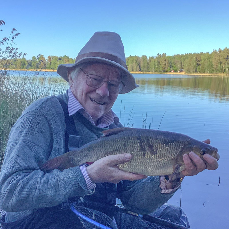 Angler holding an ide caught in Sweden